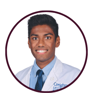 Headshot of Jaikin Patel, MD and MBA candidate and a Research Intern at Paterna BioSciences, wearing a Creighton University white coat, smiling and passionate about advancing male fertility